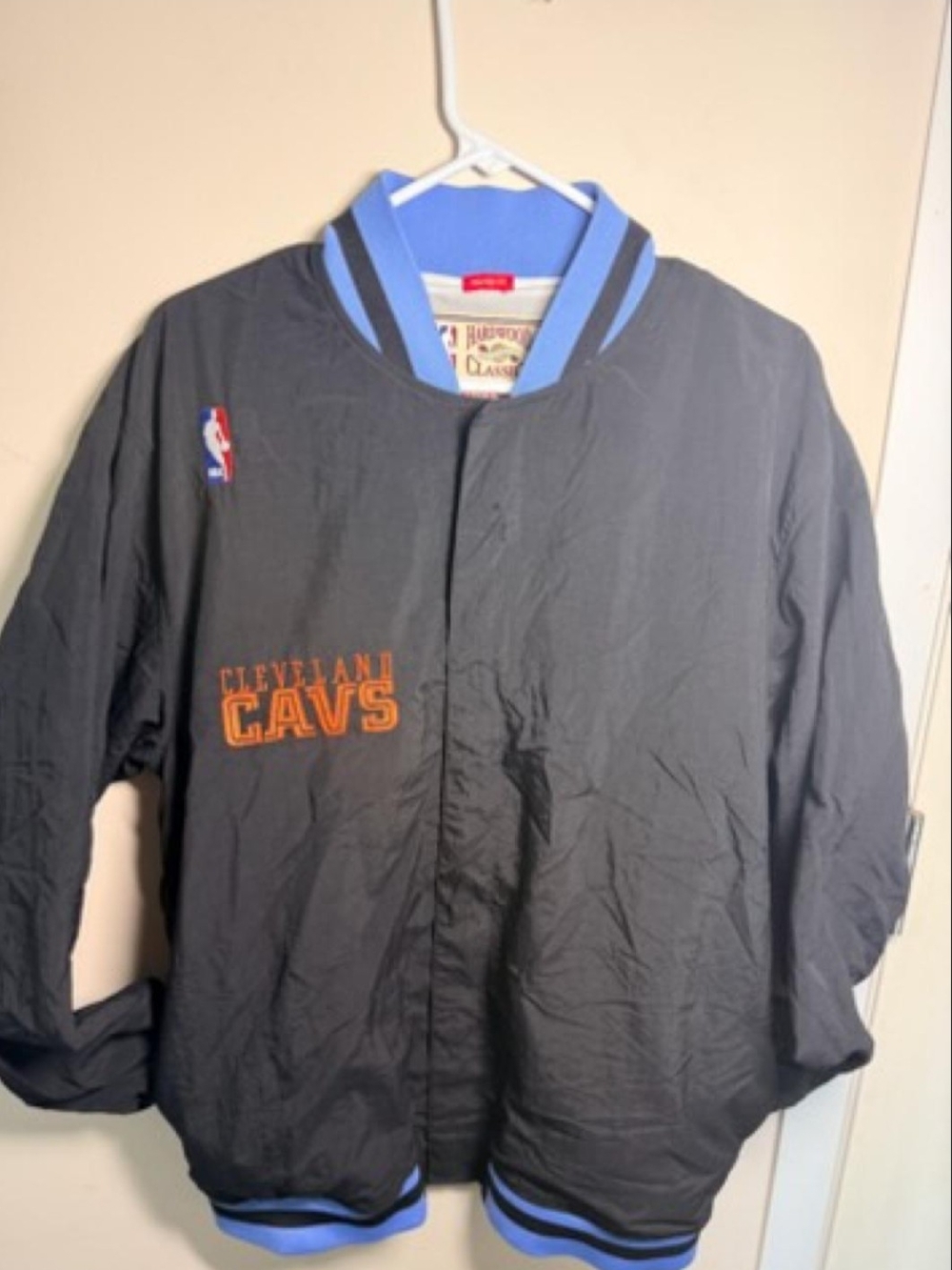Mitchell & Ness Cleveland Cavs Black Bomber Jacket with Blue Trim